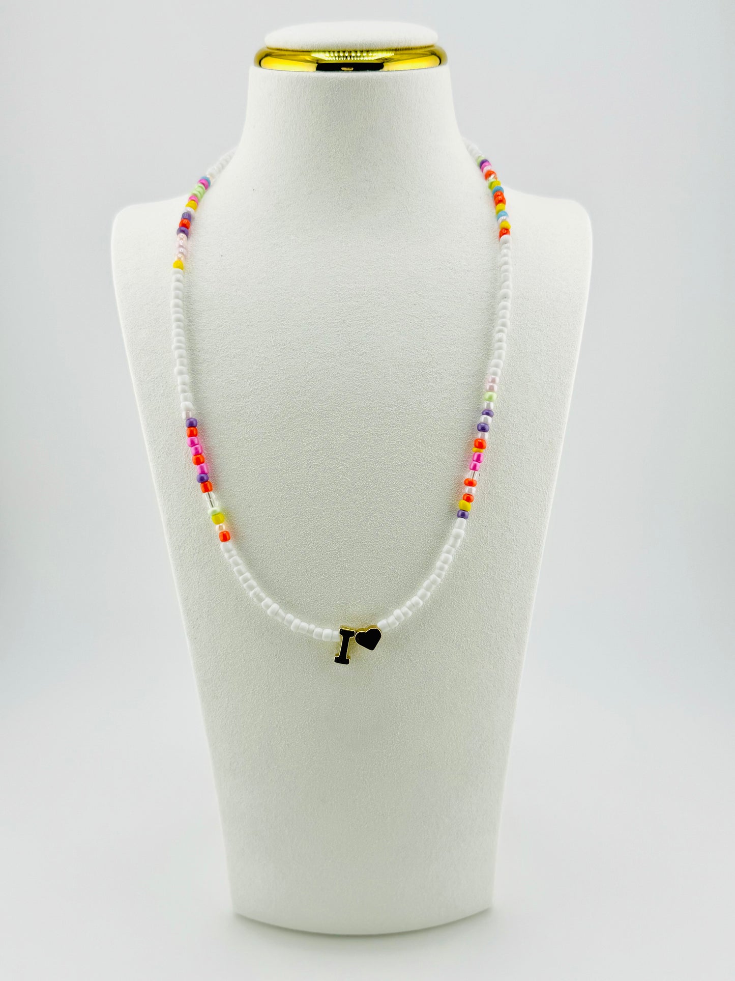 I beaded Initial necklace in white and pastel colors