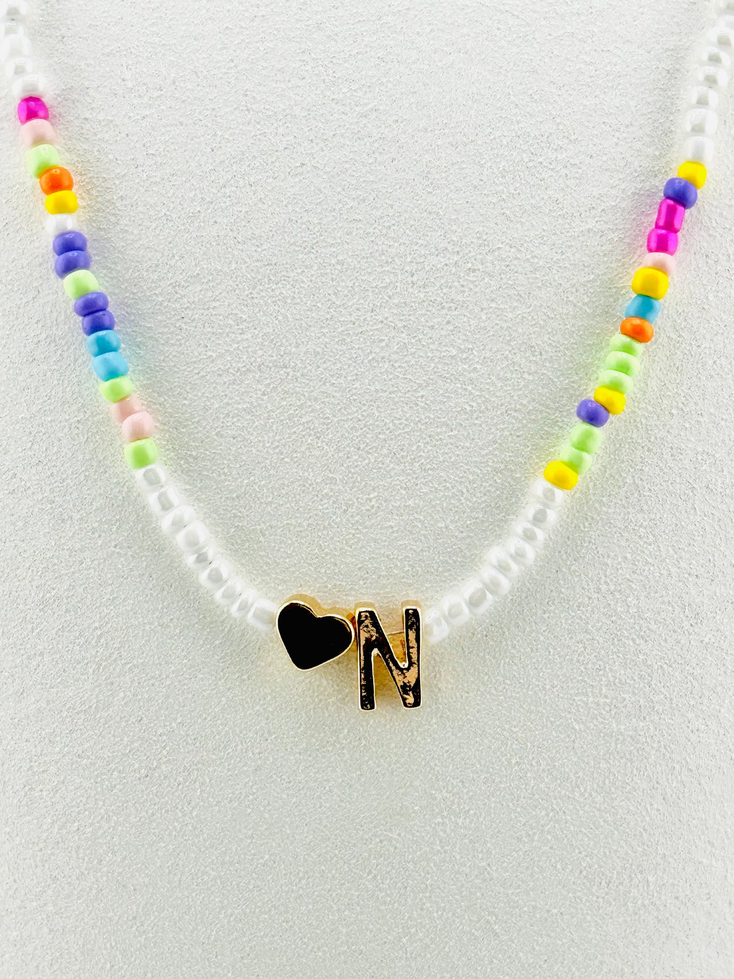 N beaded Initial necklace in white and pastel colors