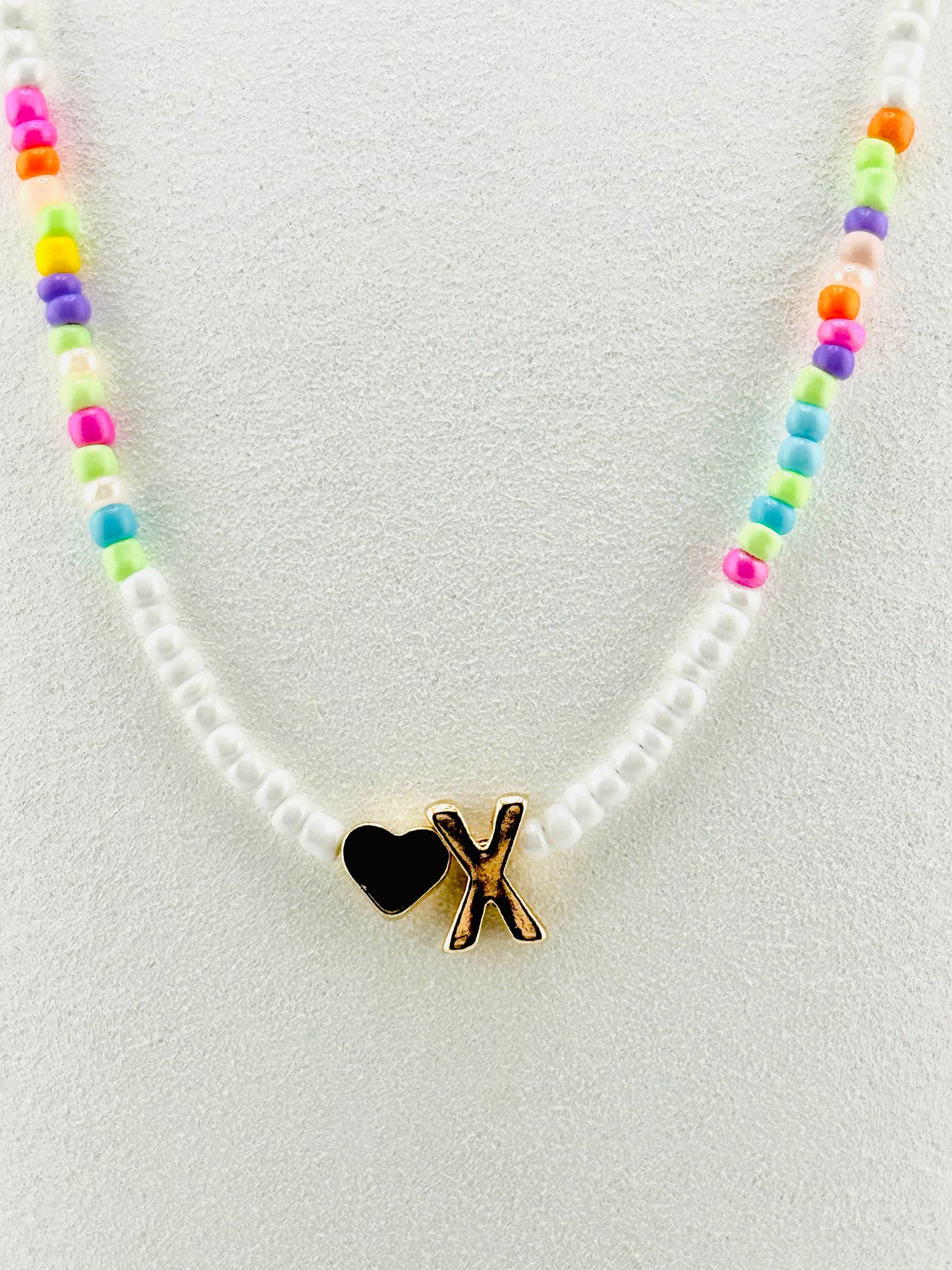 X beaded Initial necklace in white and pastel colors