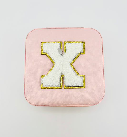 Letter X travel jewelry case in pink
