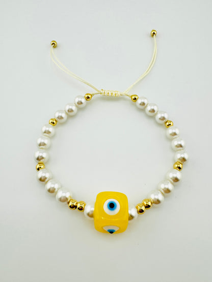 Scarlet yellow evil eye with faux pearl bracelet
