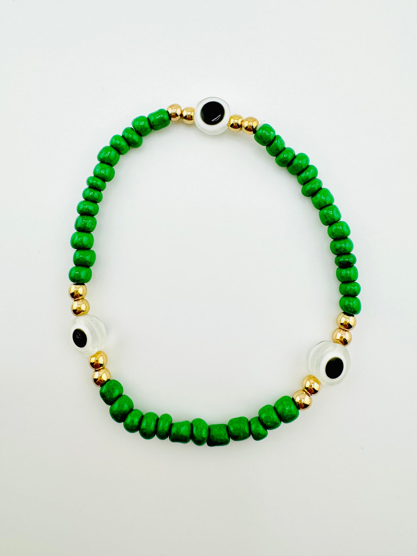 Green and gold evil bracelet