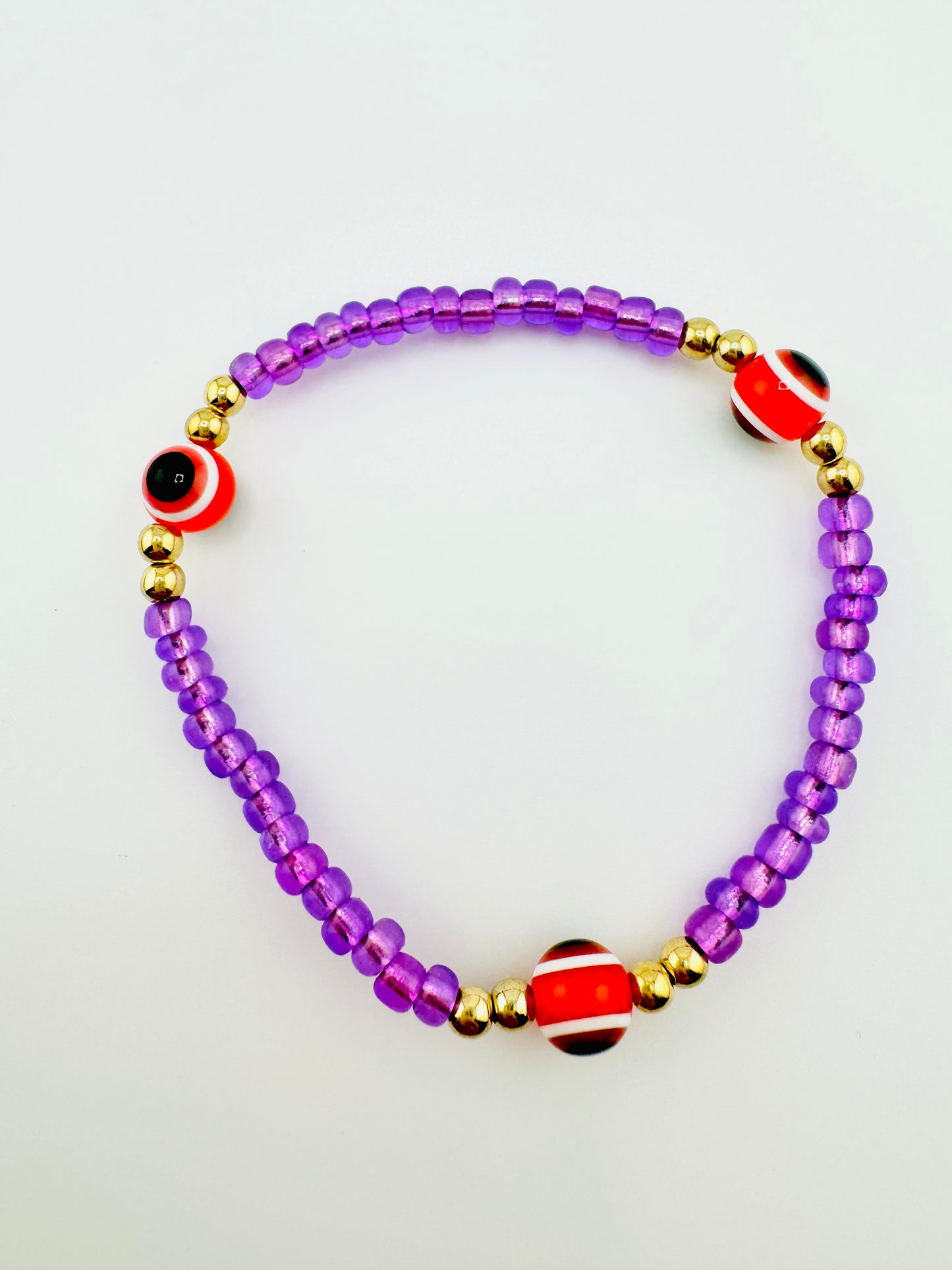 Purple and gold evil eye bracelet